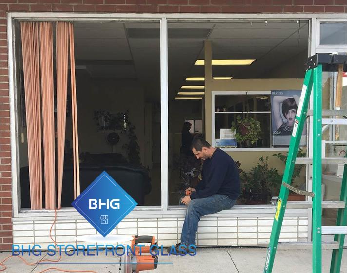 Technician repairing a commercial window
